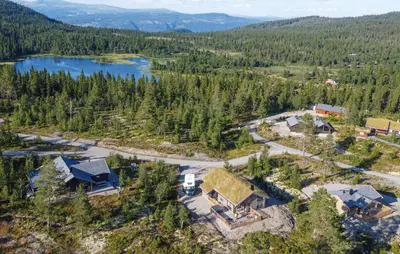 an aerial view of a house with a lake at Awesome Home In Gålå With Sauna in Gålå