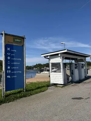 a bus stop with a sign in front of it at Korssundvegen 230 in Korssund