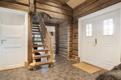 a staircase in a room with wooden walls at Trysilfjell 811 by Vacation Trysil in Trysil
