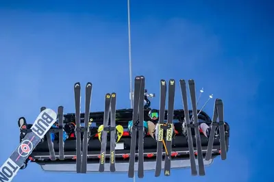 a bunch of skis on a ski rack at Skogsbu - Stylish, Close to Ski centers and hiking trails in Nesbyen