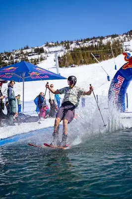 a man is water skiing on the water at Skogsbu - Stylish, Close to Ski centers and hiking trails in Nesbyen