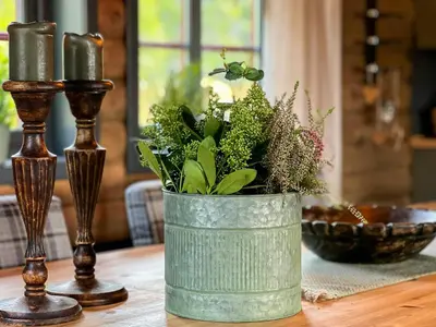 a green vase with plants in it on a table at Newly Renovated Cabin By Sjusjoen Ski Slopes in Sjusjøen