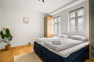a bedroom with a large bed in a room at Spacious Gem In Old Town I NEW 2025 I 3 Bed 2 Bath in Bergen
