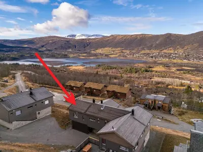 an aerial view of a house with a red arrow at Moderne leilighet i Vestlia-Ski in ski out in Geilo