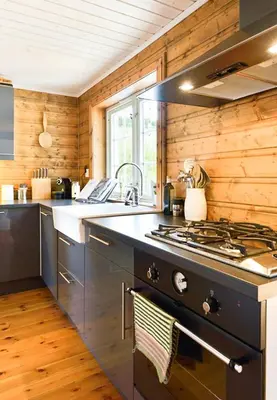 a kitchen with a stove top oven in a room at Traditional Cabin With Annex In The Mountains in Gol