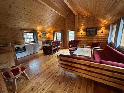 a living room with a couch and chairs in a cabin at Bjorliheimen Fjellhotell-Hytte 11 & 12 in Bjorli