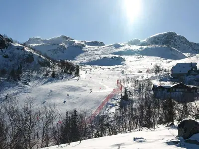 a group of people skiing down a snow covered mountain at Lodge With Views Of Gaustatoppen Mountain in Rjukan