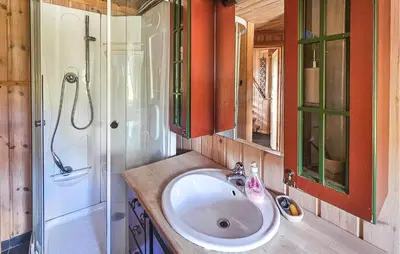 a bathroom with a sink and a shower at 4 Bedroom Stunning Home In Tuddal in Tuddal