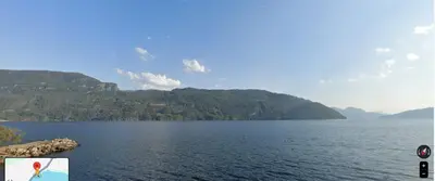 a view of a lake with mountains in the background at Sauda 4 bedrooms near skiing with view of fjord in Sauda