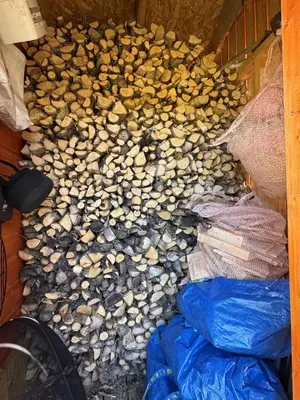 a pile of rocks on the ground next to a bike at Bjørnebo, Family cabin in Torpo