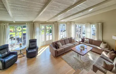 a living room with a couch and a table at Stunning Home In Vikebygd With House A Mountain View in Vikebygd
