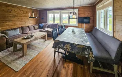 a living room with a table and a couch at Amazing Home In Veggli With Wifi in Veggli
