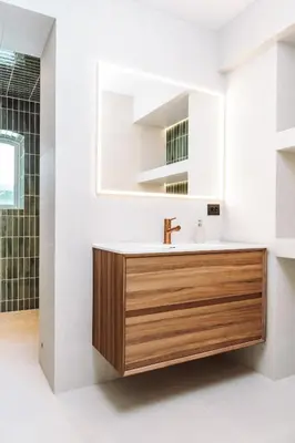a bathroom with a sink and a mirror at Large city apartment with sea view and parking in Ålesund