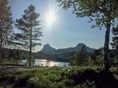 a view of a lake with mountains in the background at Renovated Cabin By Lake Djupedal in Bygstad