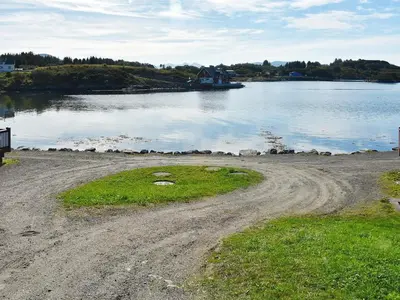 a dirt road next to a body of water at 6 person holiday home in Bud-By Traum in Bud