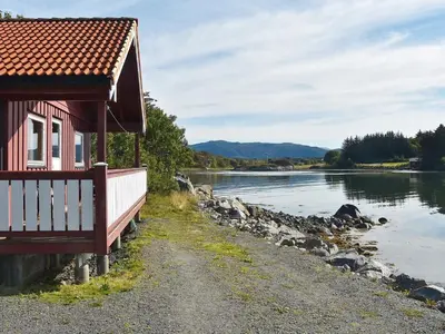 a building next to a body of water at 6 person holiday home in Bud-By Traum in Bud
