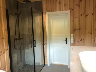 a shower with a glass door in a bathroom at 12 person holiday home in Skare-By Traum in Skare