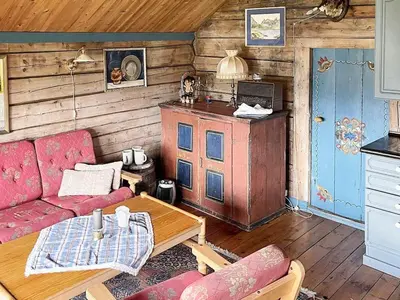 a living room with a couch and a table at 4 person holiday home in Bryggja-By Traum in Bryggja