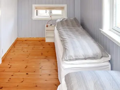 a hospital room with a bed and a window at 8 person holiday home in FREI in Frei