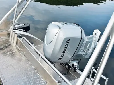 a boat sitting on the side of the water at 8 person holiday home in FREI in Frei