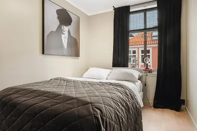 a bedroom with a bed and a window at Modern & Chic Apartment Luxurious Details in Bergen