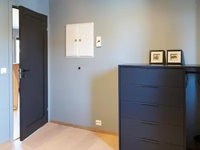 a room with a blue dresser and a door at 10 person holiday home in INDERØY-By Traum in Kjerkenesvåg