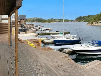 a bunch of boats are docked at a dock at 8 person holiday home in Urangsvåg in Ervik