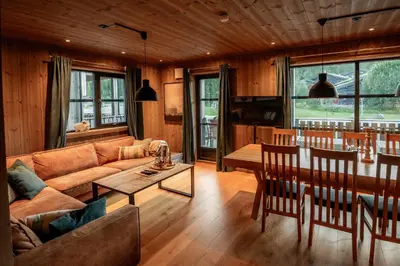 a living room with a couch and a table at Trysiltunet 10B in Trysil