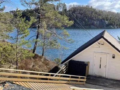 a cabin with a view of a lake at 6 person holiday home in Rubbestadneset in Rubbestadneset
