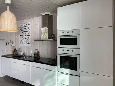 a kitchen with white appliances and a black counter top at 6 person holiday home in Rubbestadneset in Rubbestadneset