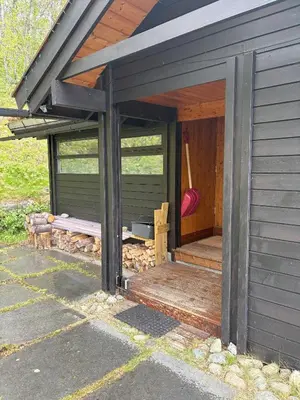 an outside view of a house with a porch at Cosy cabin in Hemsedal with ski in-ski out to Solheisen in Hemsedal