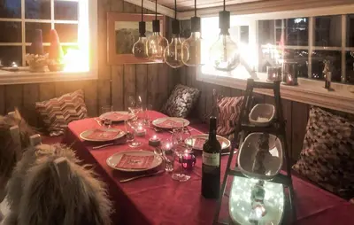 a table with wine bottles and glasses on it at 3 Bedroom Lovely Home In Dagali in Dagali
