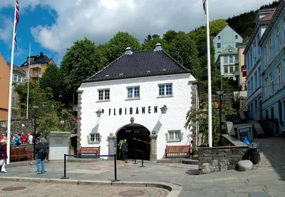 a large white building with a sign on it at Charming apt in the centre of Bergen in Bergen