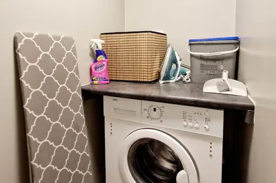 a laundry room with a washing machine on a counter at Historic retreat in the middle of town in Bergen