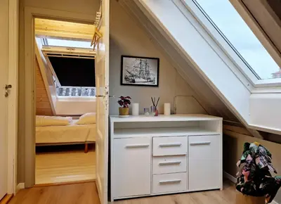 a small room with a bed and a window at Historic townhouse - 2 baths 3 floors 100 percent charm in Bergen