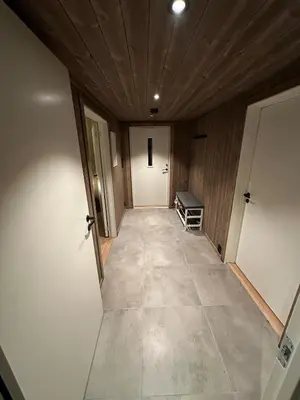 an empty hallway with a door and a room at Cozy little cottage for rent in Oppheim in Ål