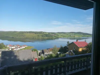 a view of a lake from a balcony at The top half of a house with sea view in Steinkjer
