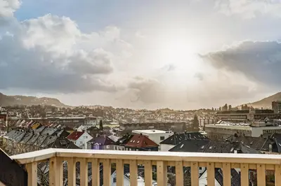 a view of a city from a balcony at Privat rom i koselig Bergenshus in Bergen