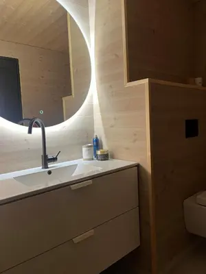 a bathroom with a sink and a mirror at New cabin in beautiful surroundings in Oppdal