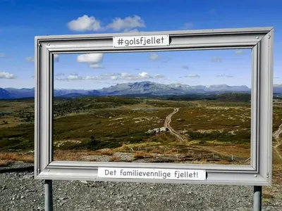 a framed picture of a field with mountains at Mountain Gem With Ski In And Out At Golsfjellet in Gol