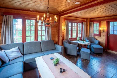 a living room with a couch and a table at Lisetra 716A in Trysil