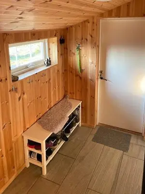 a small room with a bench in a wooden house at Family Cabin At Birkebeiner Slopes In Sjusjøen in Sjusjøen