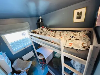 a small bedroom with a bunk bed and a window at Family house in Hemsedal in Hemsedal