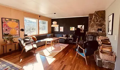 a living room with a couch and a table at Family house in Hemsedal in Hemsedal