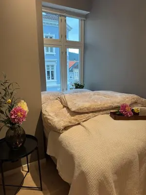 a bedroom with a bed and a window at Bergen city centre, fantastic, new apartment in Bergen
