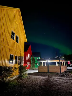 an image of the aurora dancing in the sky at Martini Fishing Camp in Lauvsnes