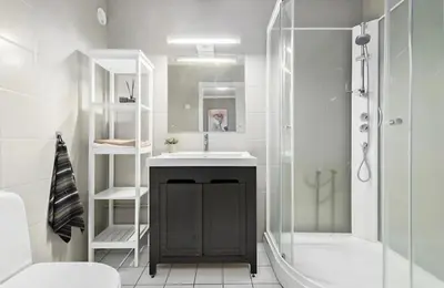 a bathroom with a sink and a shower at Mountain apartment Norefjell Ski in ski out in Surteberg