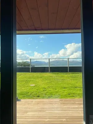 a window view of a field from a house at Modern apartment with view in Lii