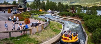 a group of people riding on a raft in a river at Flora in Lillehammer