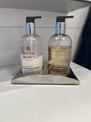 two bottles ofodorizers sitting on top of a counter at Fossen bratte chalet in Eikedalen